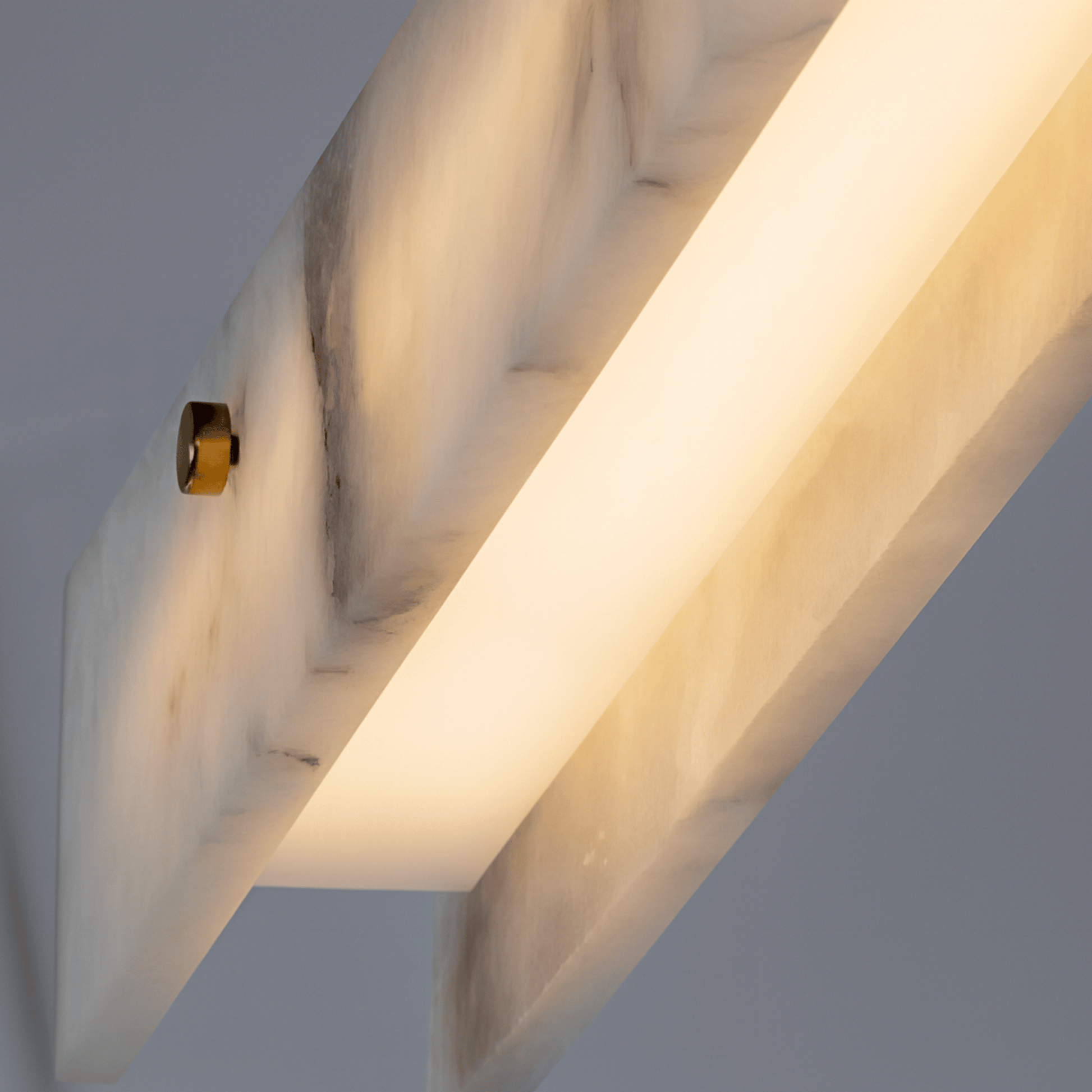 Close-up of a modern light fixture with a neutral background