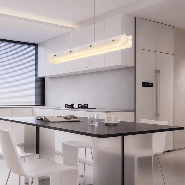Modern kitchen with a black dining table and white chairs.