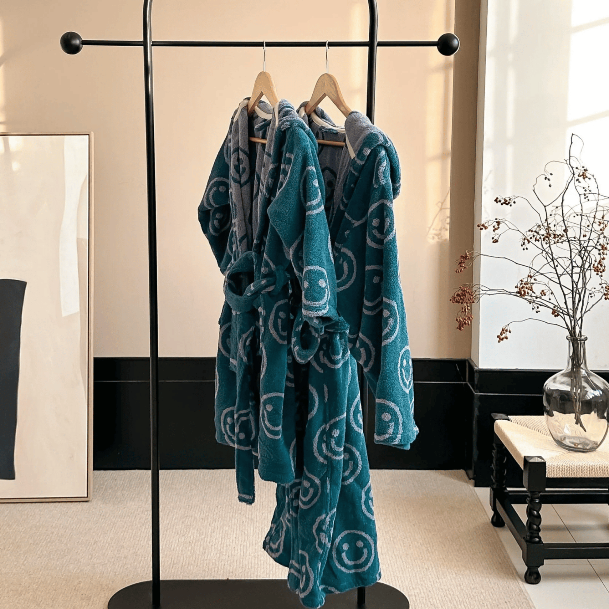 Blue patterned robe hanging on a rack in a bathroom setting