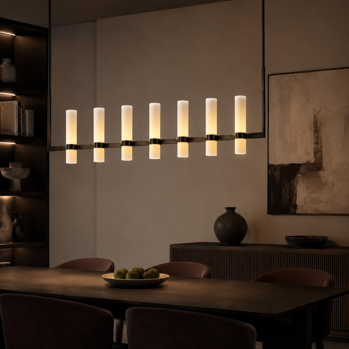 Modern chandelier in a dining room setting with a neutral color palette.