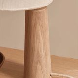 Close look at the stand of our Vintage Solid Wood LED Table Lamp with Fabric Shade for Living Room and Study  on a coffee table.