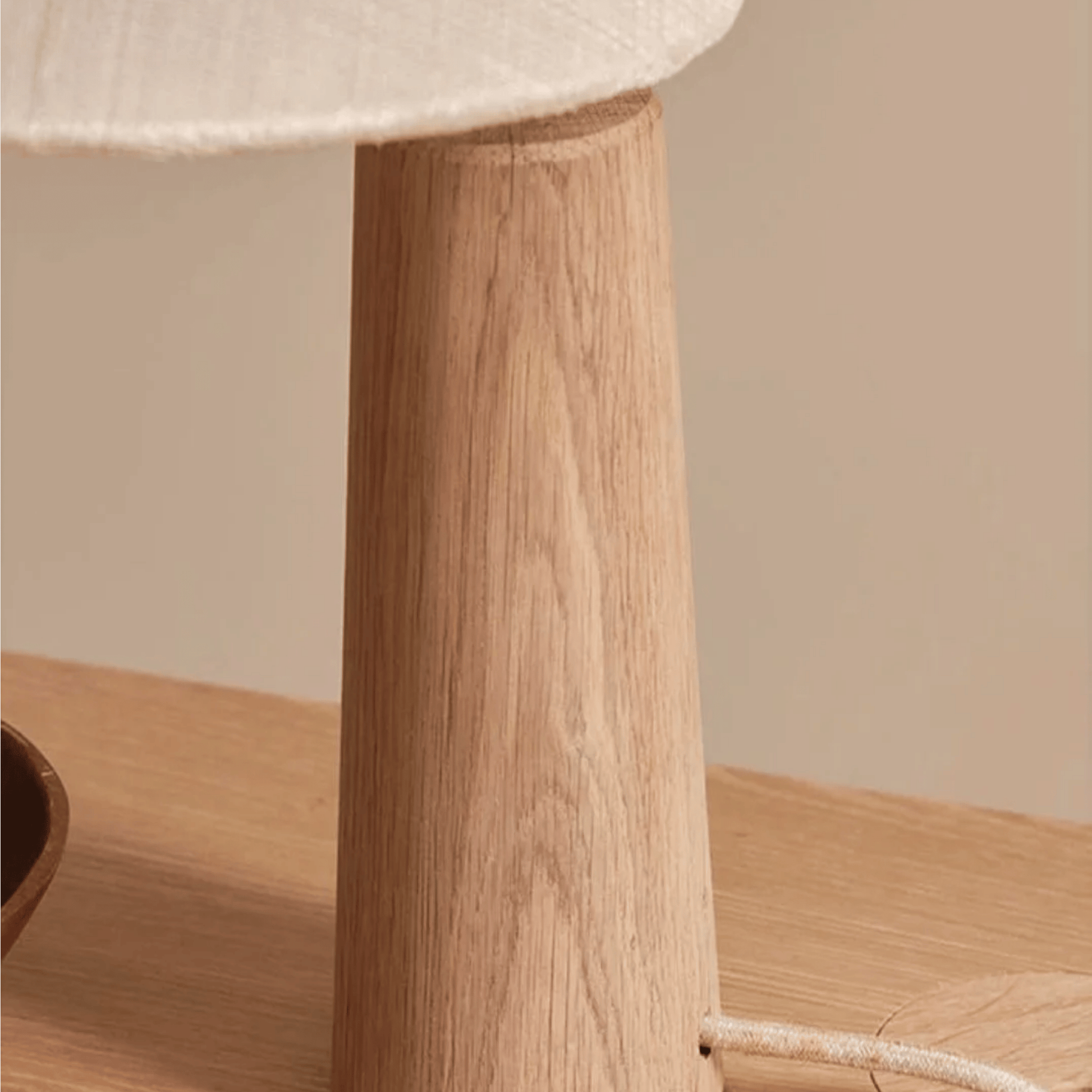 Close look at the stand of our Vintage Solid Wood LED Table Lamp with Fabric Shade for Living Room and Study  on a coffee table.