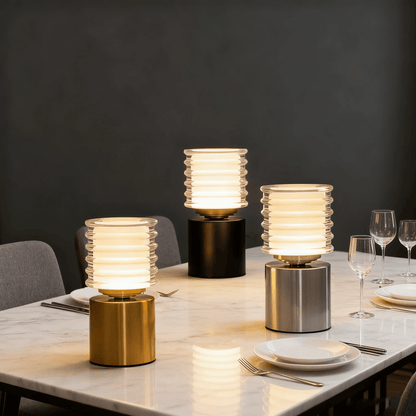 Three table lamps on a dining table with a dark background