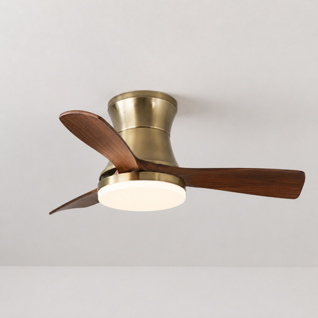 Ceiling fan with brass finish and wooden blades on a white background