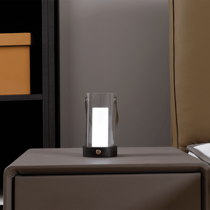 Modern table lamp on a nightstand with a neutral background