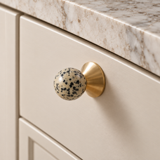 Solvi Brass Ball Cabinet Knobs – Spotted – Close-up installed on cream cabinetry