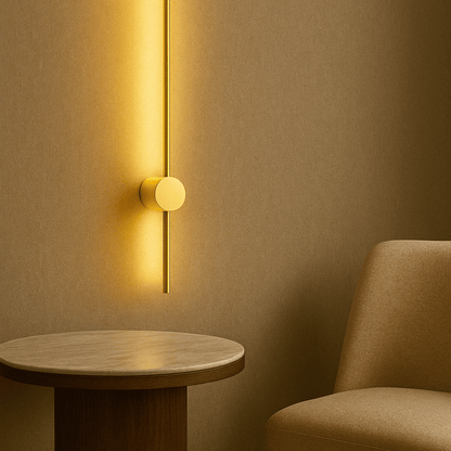 Modern wall light fixture on a textured wall with a round wooden table and chair.