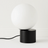 Noctura Brass & Glass Ball table Lamp styled in a bedroom — modern interior by Baskoraa