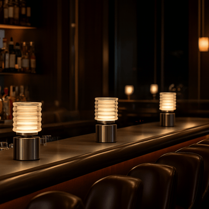 Decorative lamps on a bar counter with a dark, cozy ambiance.