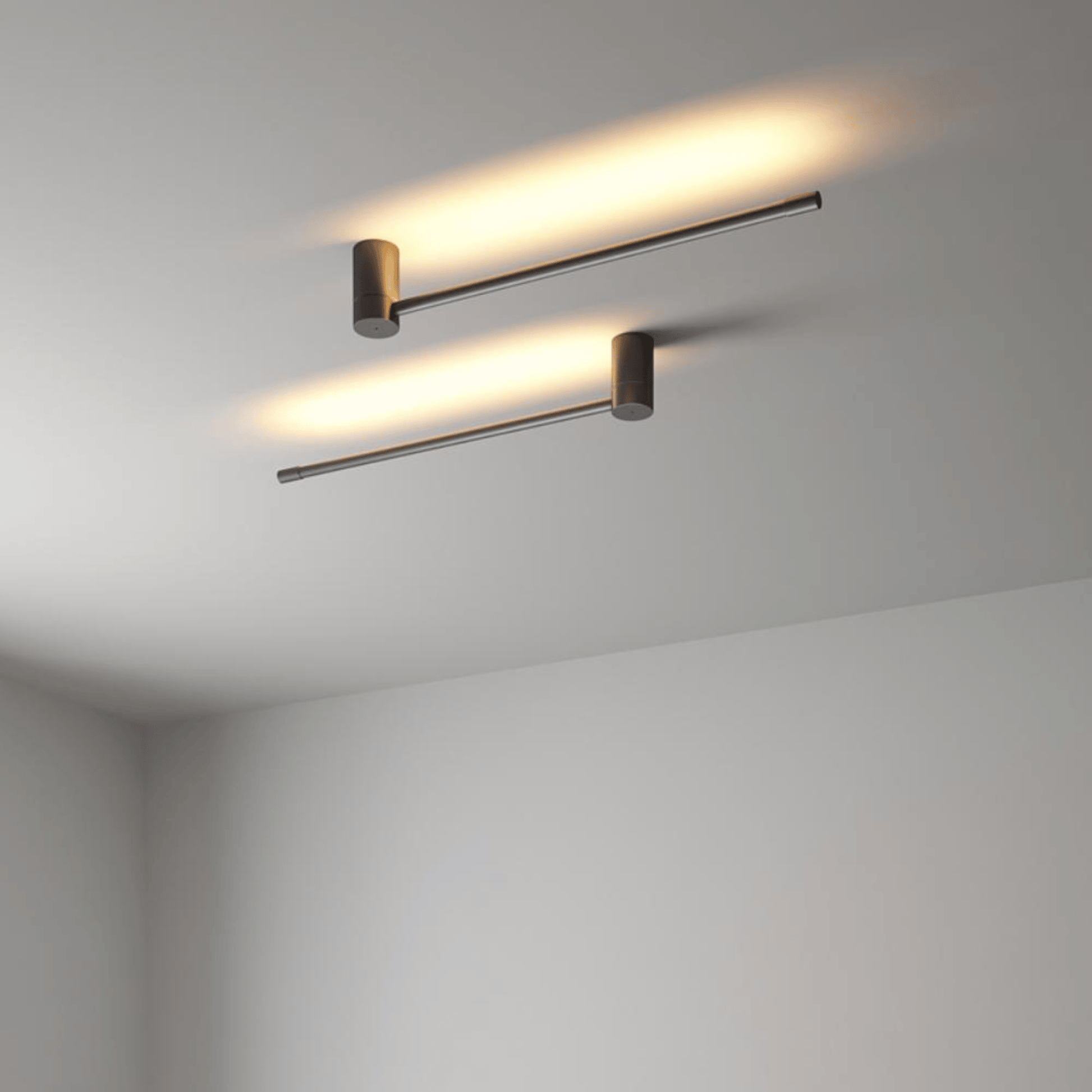 Two modern ceiling lights on a plain wall