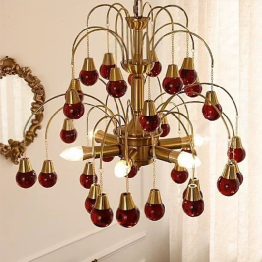 Chandelier with red and gold bulbs in a room setting