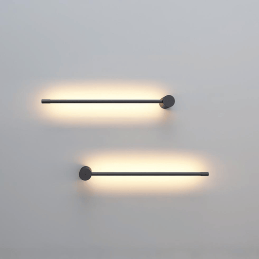 Two modern wall lights on a plain wall