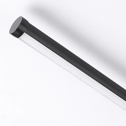 Black cylindrical object on a white background