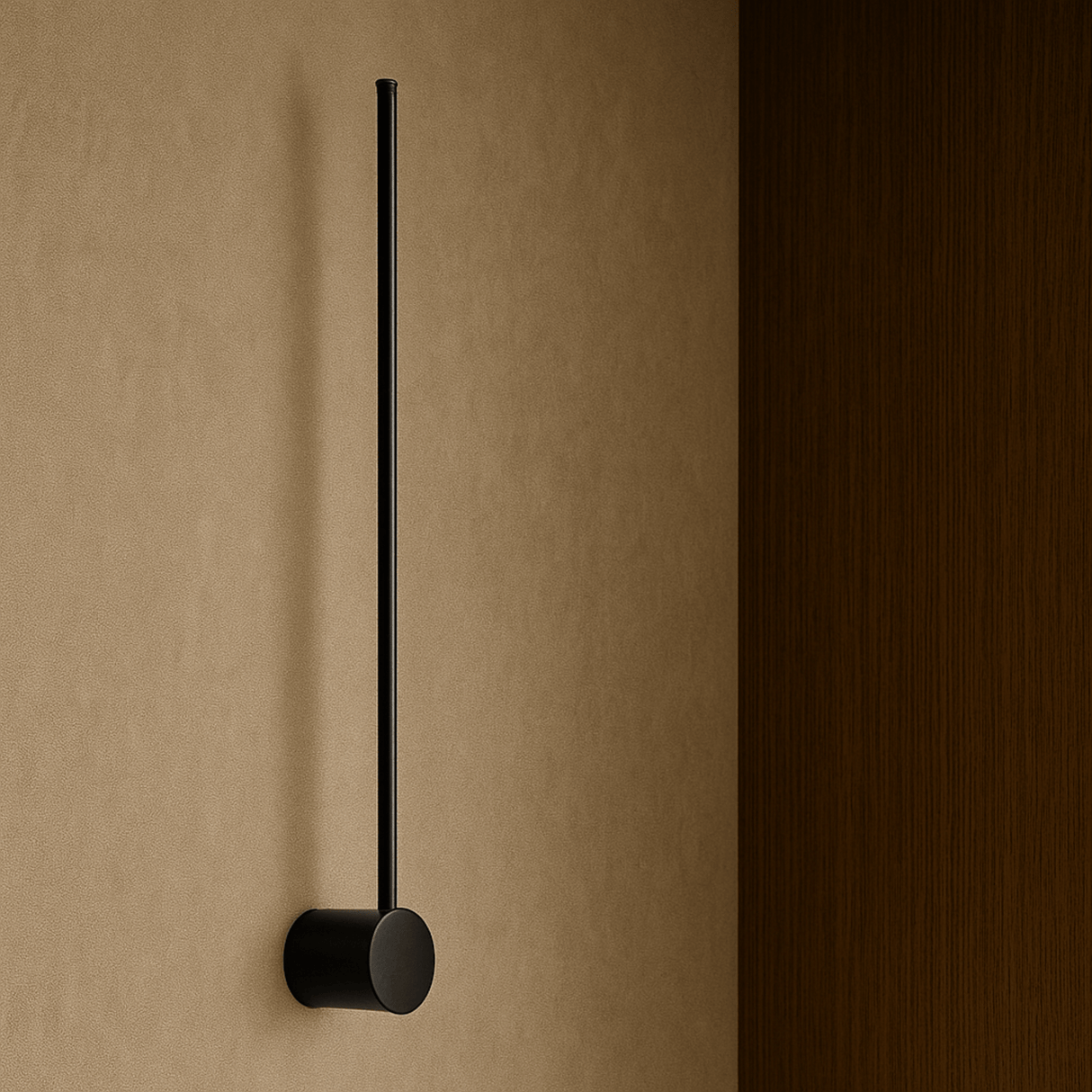 Black wall-mounted towel holder on a beige wall