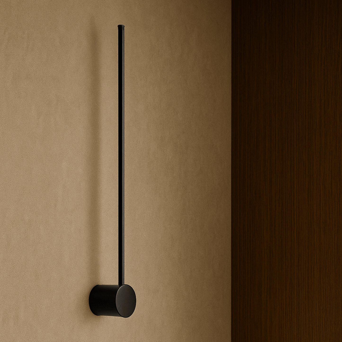 Black wall-mounted towel holder on a beige wall