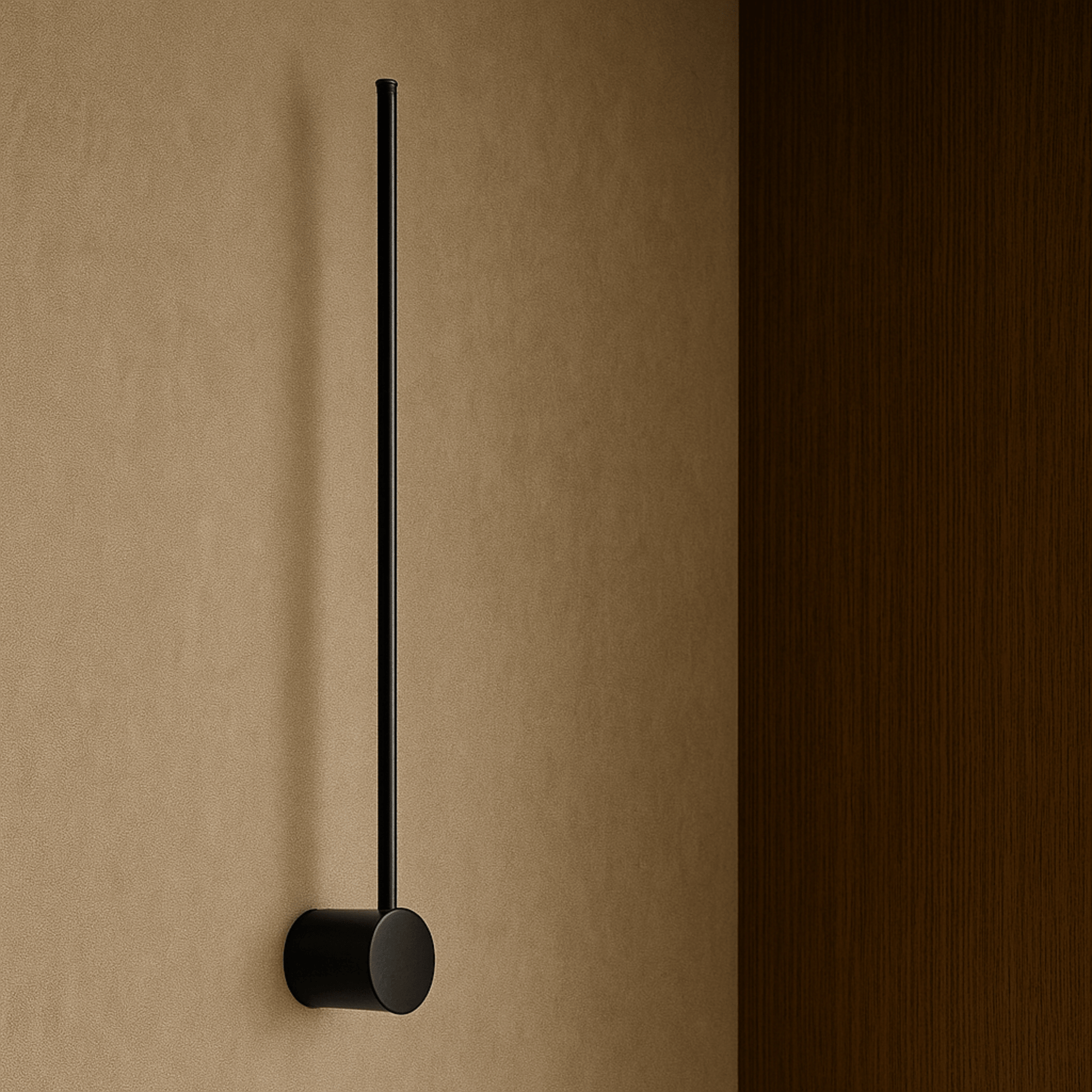 Black wall-mounted towel holder on a beige wall