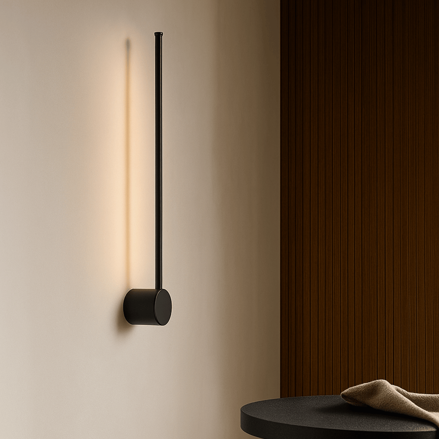 Modern wall-mounted light fixture on a neutral wall with a wooden panel.