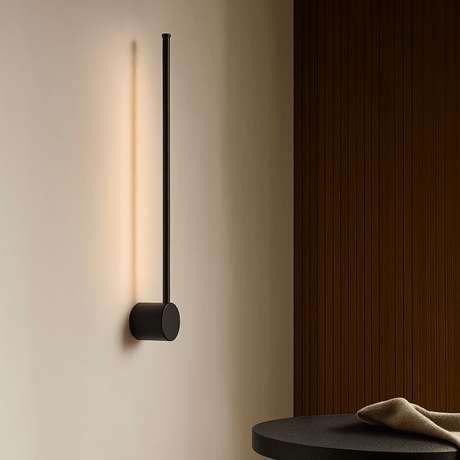 Modern wall-mounted light fixture on a neutral wall with a wooden panel.