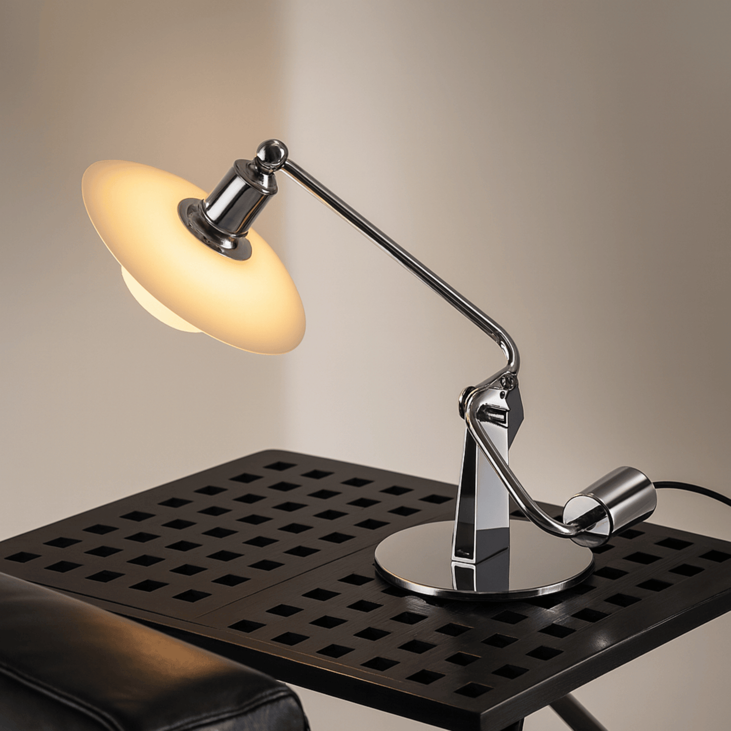 Modern desk lamp with adjustable arm on a black surface