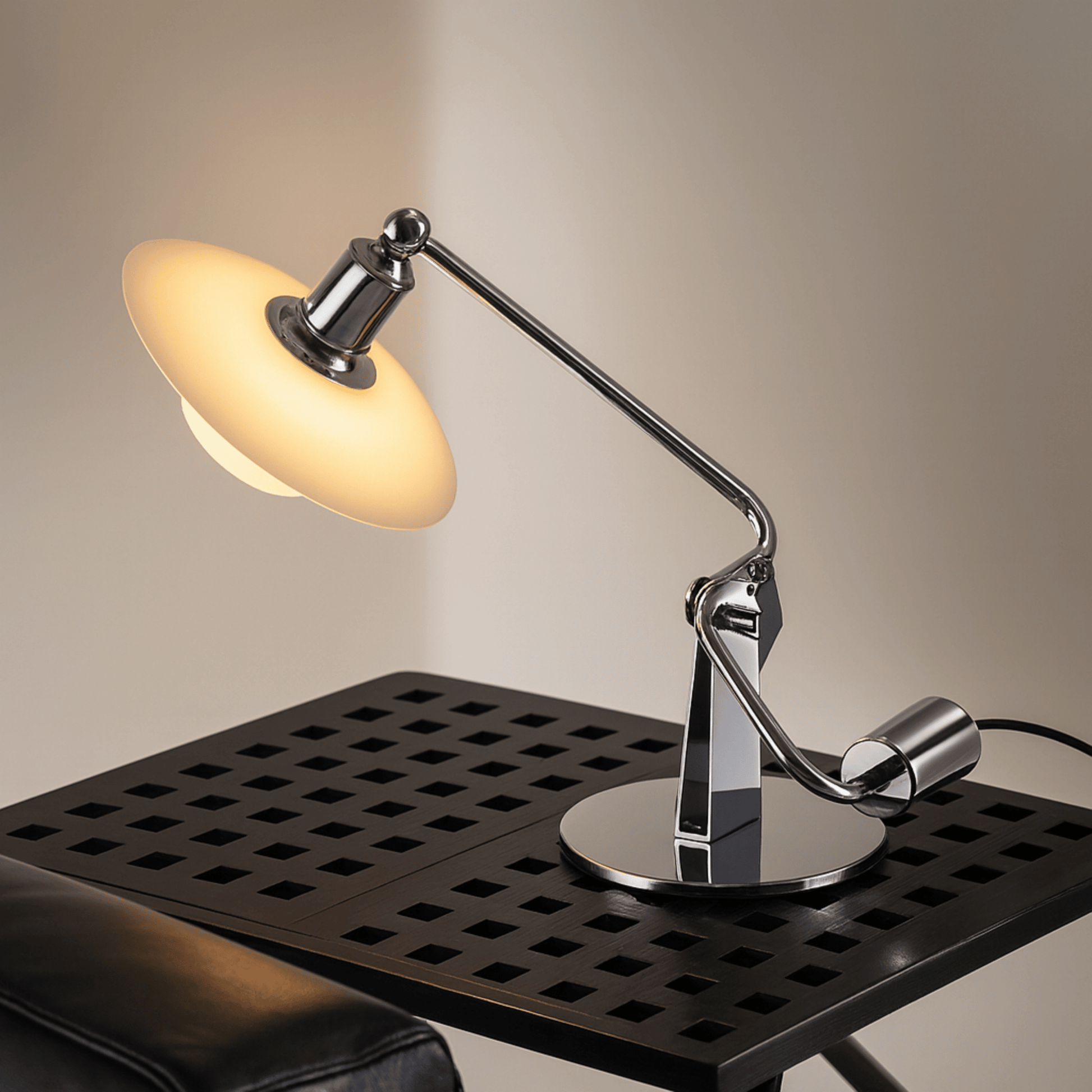 Modern desk lamp with adjustable arm on a black surface