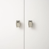 Pair of silver earrings on a white background