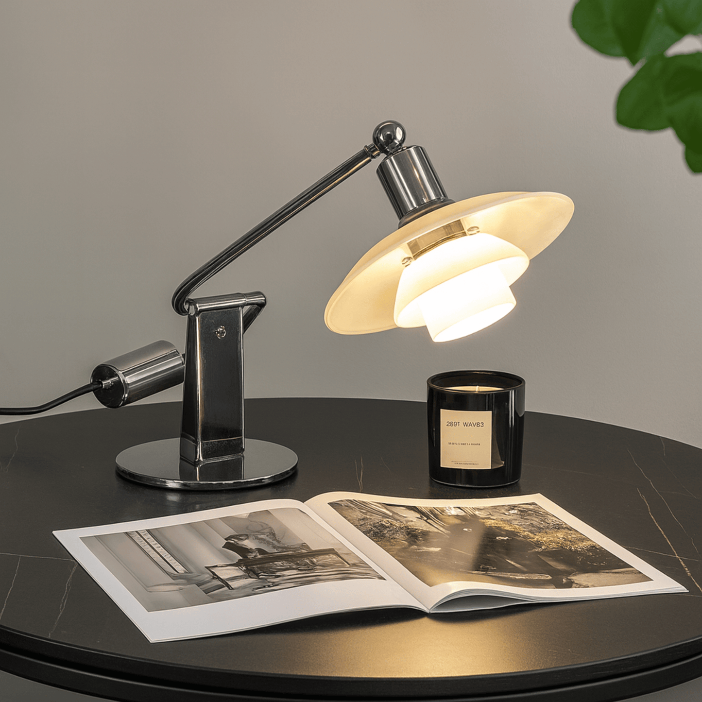 Table lamp on a round table with an open book and candle