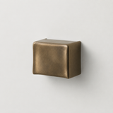 A square wall-mounted fixture with a brushed metallic bronze finish, shown against a plain light gray background.