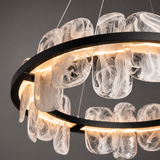Modern chandelier with glass shades on a dark background
