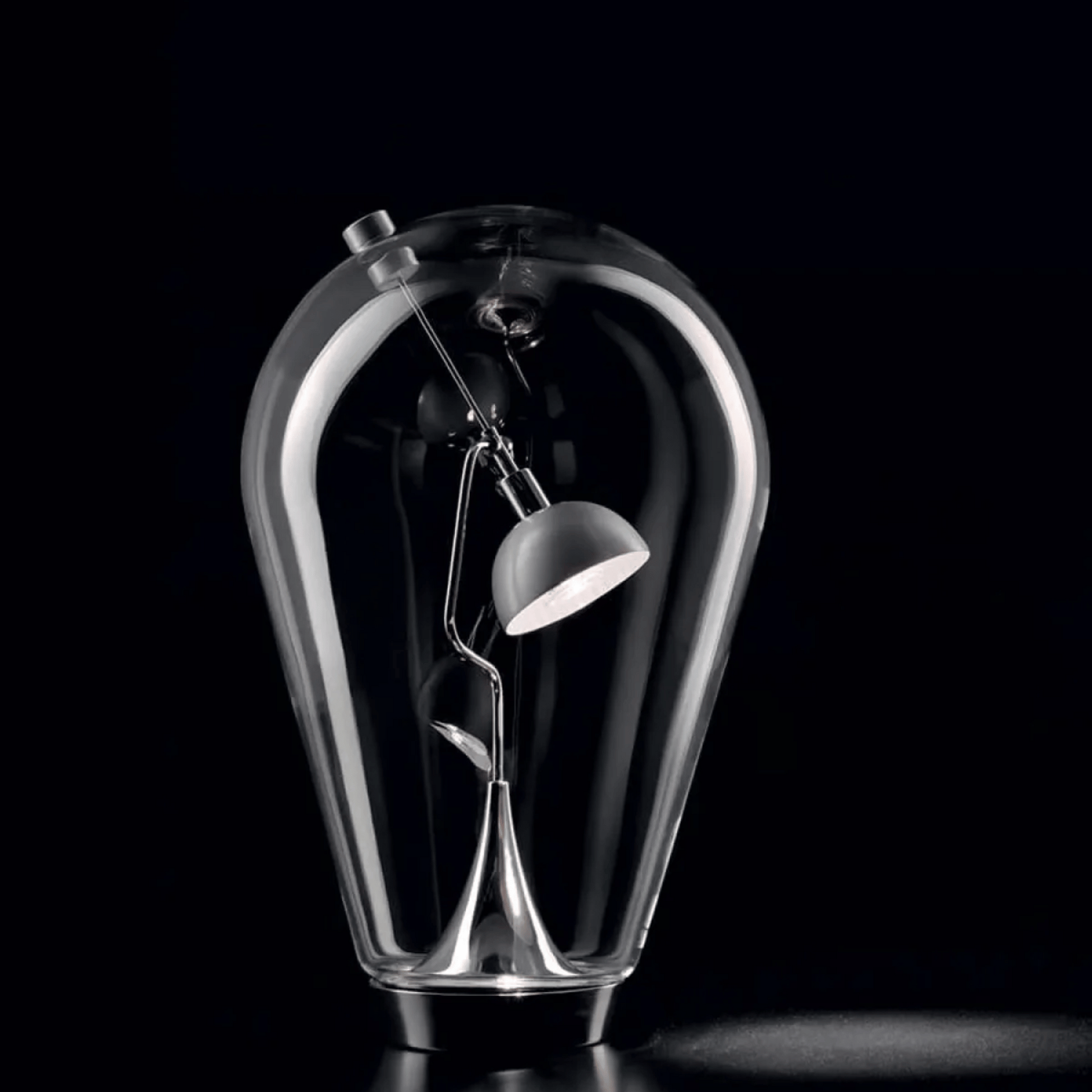 Glass bulb-shaped lamp with a smaller lamp inside on a black background