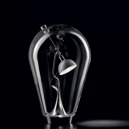 Glass bulb-shaped lamp with a smaller lamp inside on a black background