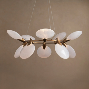 Modern chandelier with white glass shades and gold metal accents on a beige background