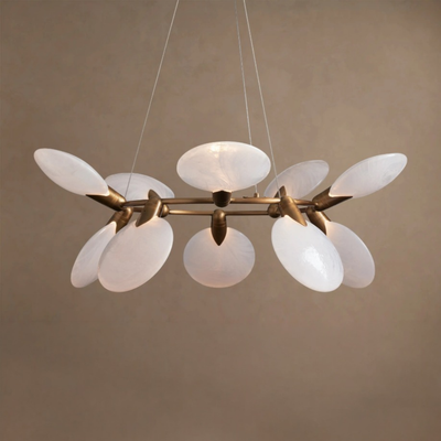 Modern chandelier with white glass shades and gold metal accents on a beige background