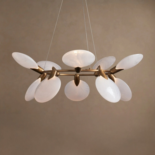 Modern chandelier with white glass shades and gold metal accents on a beige background