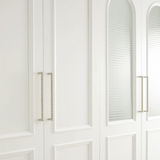 Close-up of a white cabinet with decorative elements
