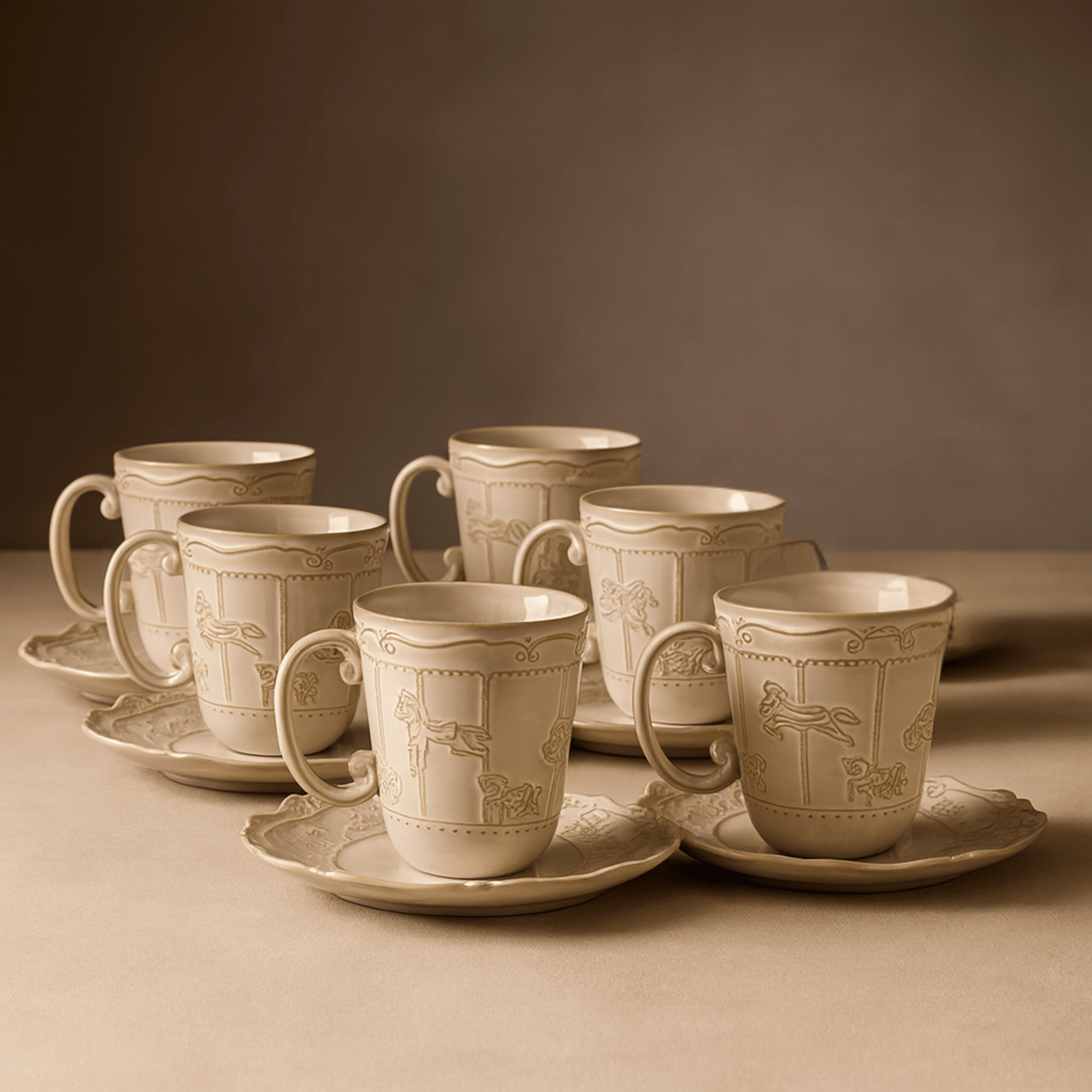 Set of ceramic cups and saucers with intricate designs on a brown background