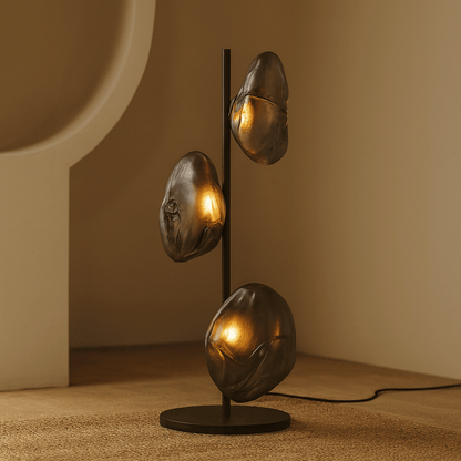 Decorative lamp with three spherical lights on a neutral background