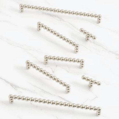 Silver beaded chains on a white background
