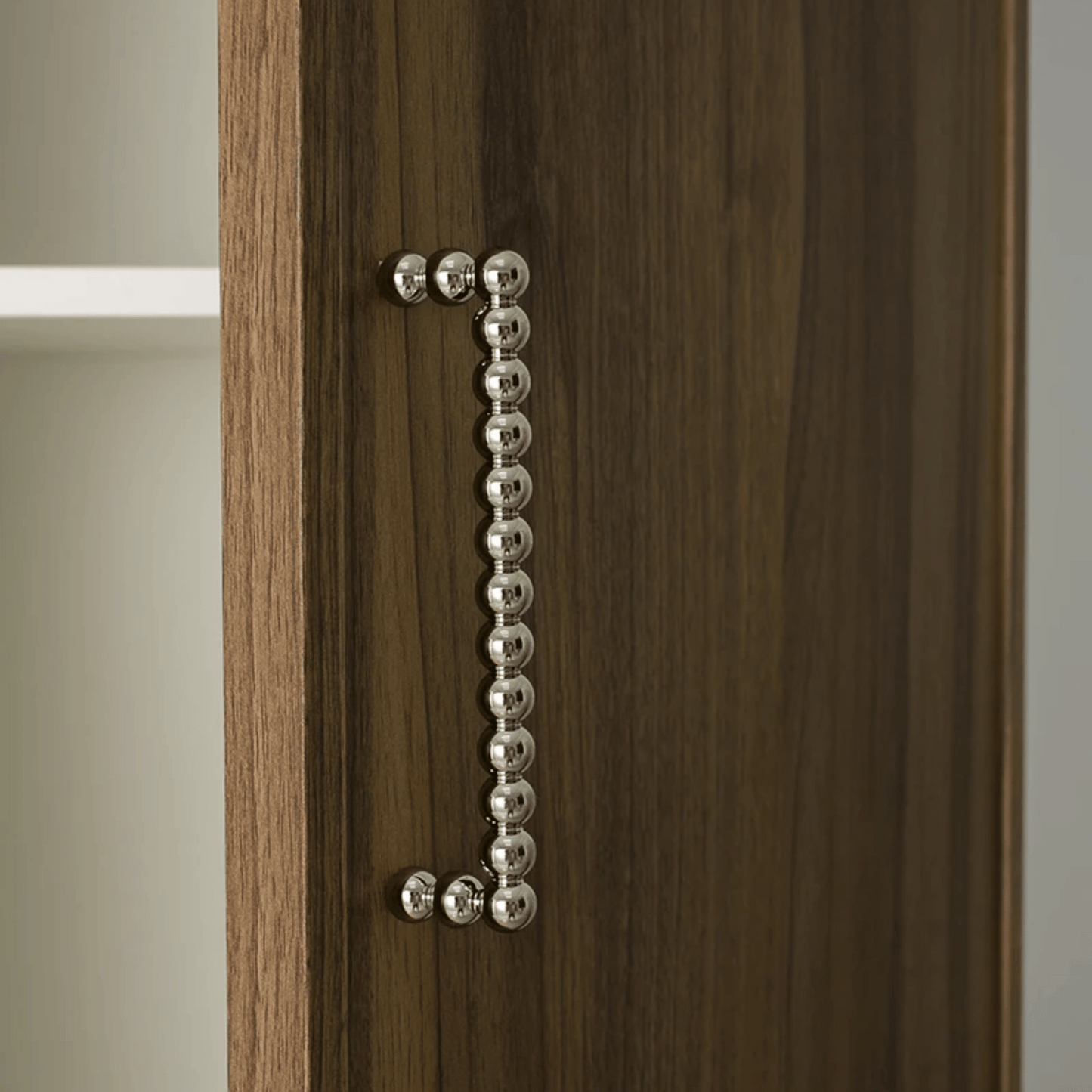 Wooden cabinet with a decorative metal handle