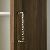 Wooden cabinet with a decorative metal handle