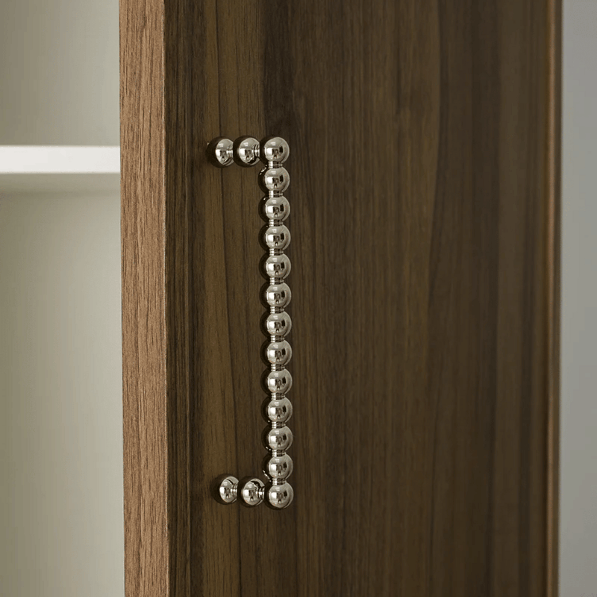 Wooden cabinet with a decorative metal handle