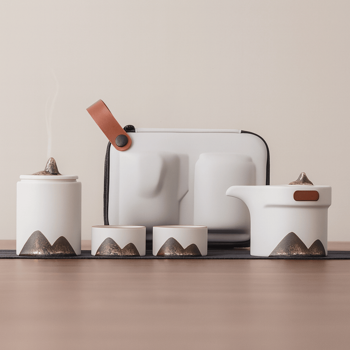 Set of ceramic containers with mountain designs on a neutral background