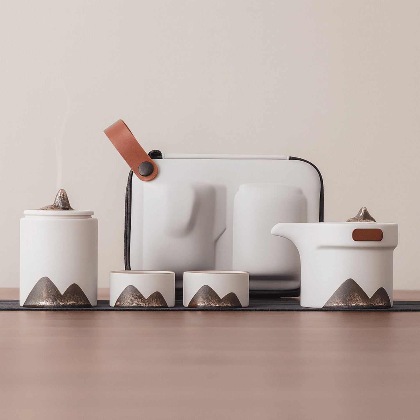 Set of ceramic containers with mountain designs on a neutral background