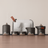 Tea set with mountain designs on a wooden surface and beige background