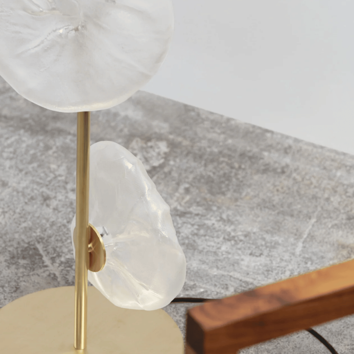 Decorative lamp with marble-like base and shade on a surface
