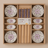 Set of ceramic plates with floral designs and wooden chopsticks in a box, featuring the brand 'JiaBaiNian'.