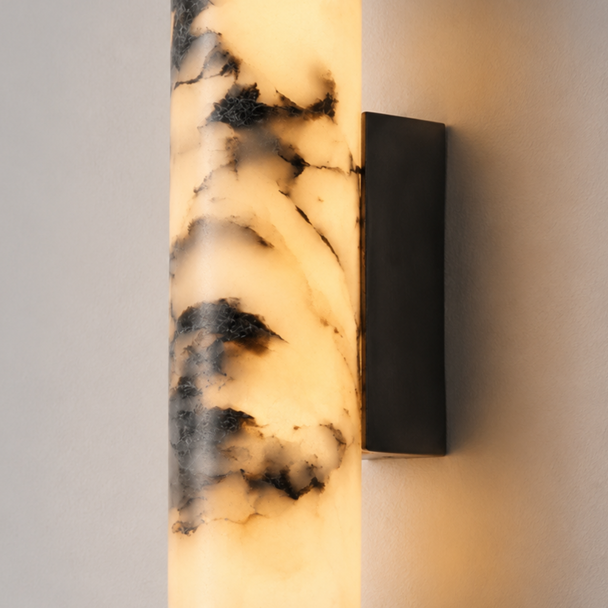 Wall-mounted light fixture with marble-like pattern on a neutral background