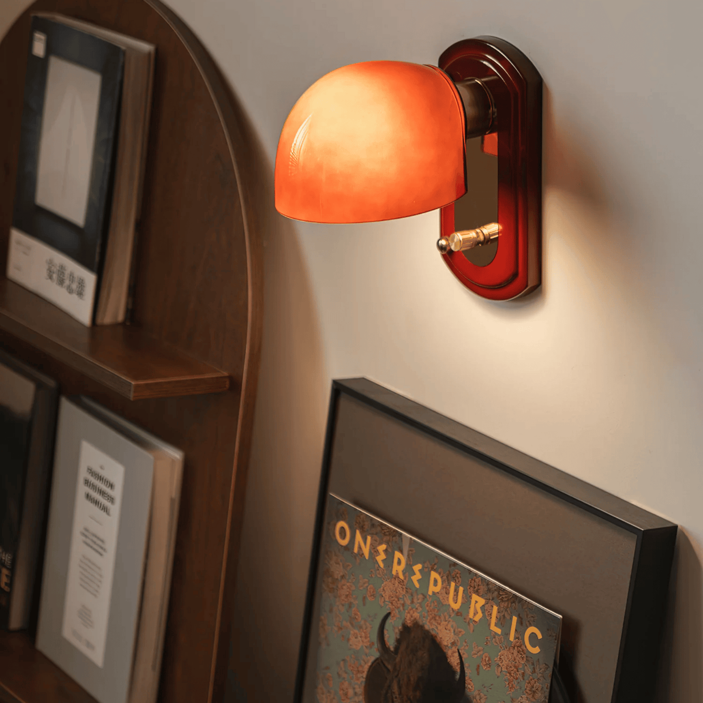 Wall-mounted lamp with a warm glow in a cozy room setting.