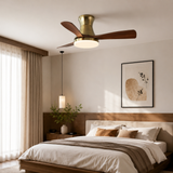 Modern bedroom with a ceiling fan, bed, and wall art.