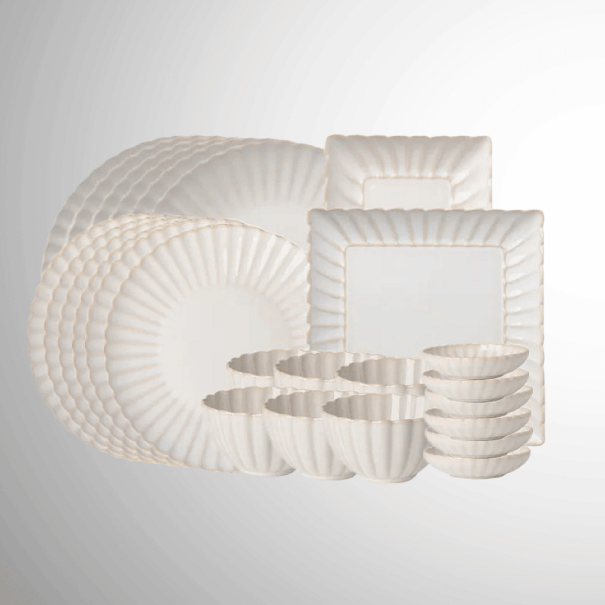Set of white ceramic dishes with textured patterns on a light gray background