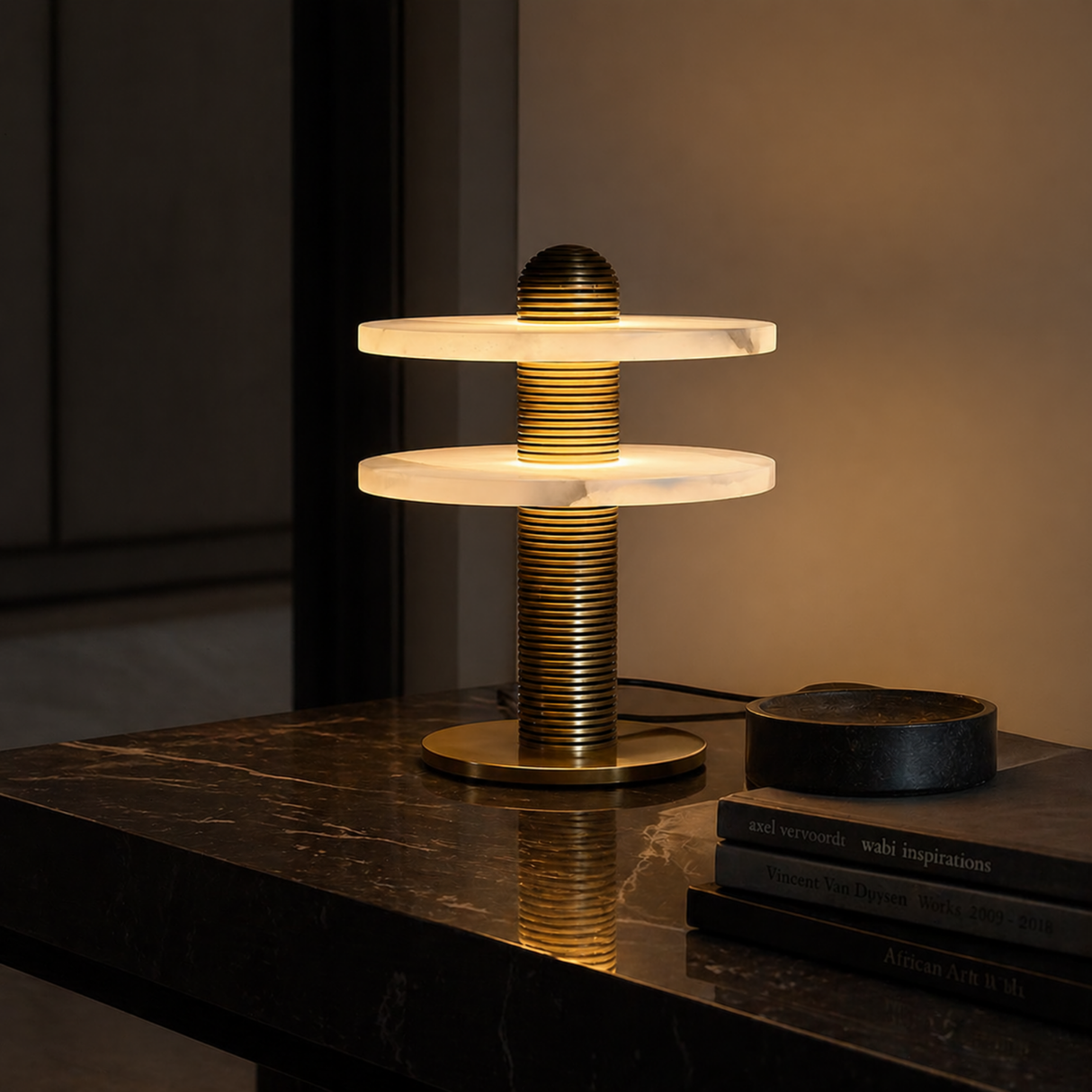 Modern table lamp with marble-like design on a dark surface